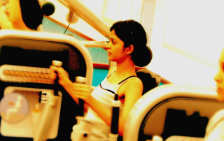 Women tone up on the resistance weight machines